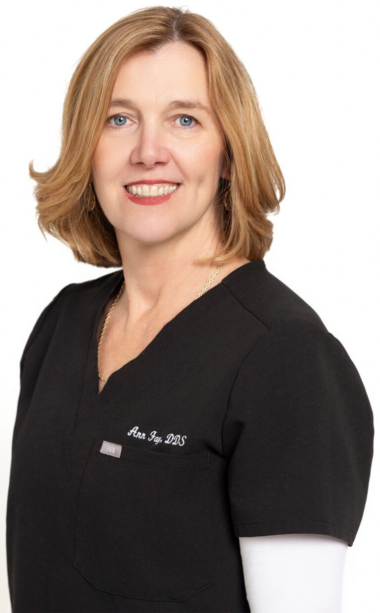 Dr. Ann Fay, DDS, smiling in professional attire, a trusted periodontist at Origin Periodontics in Shawnee.